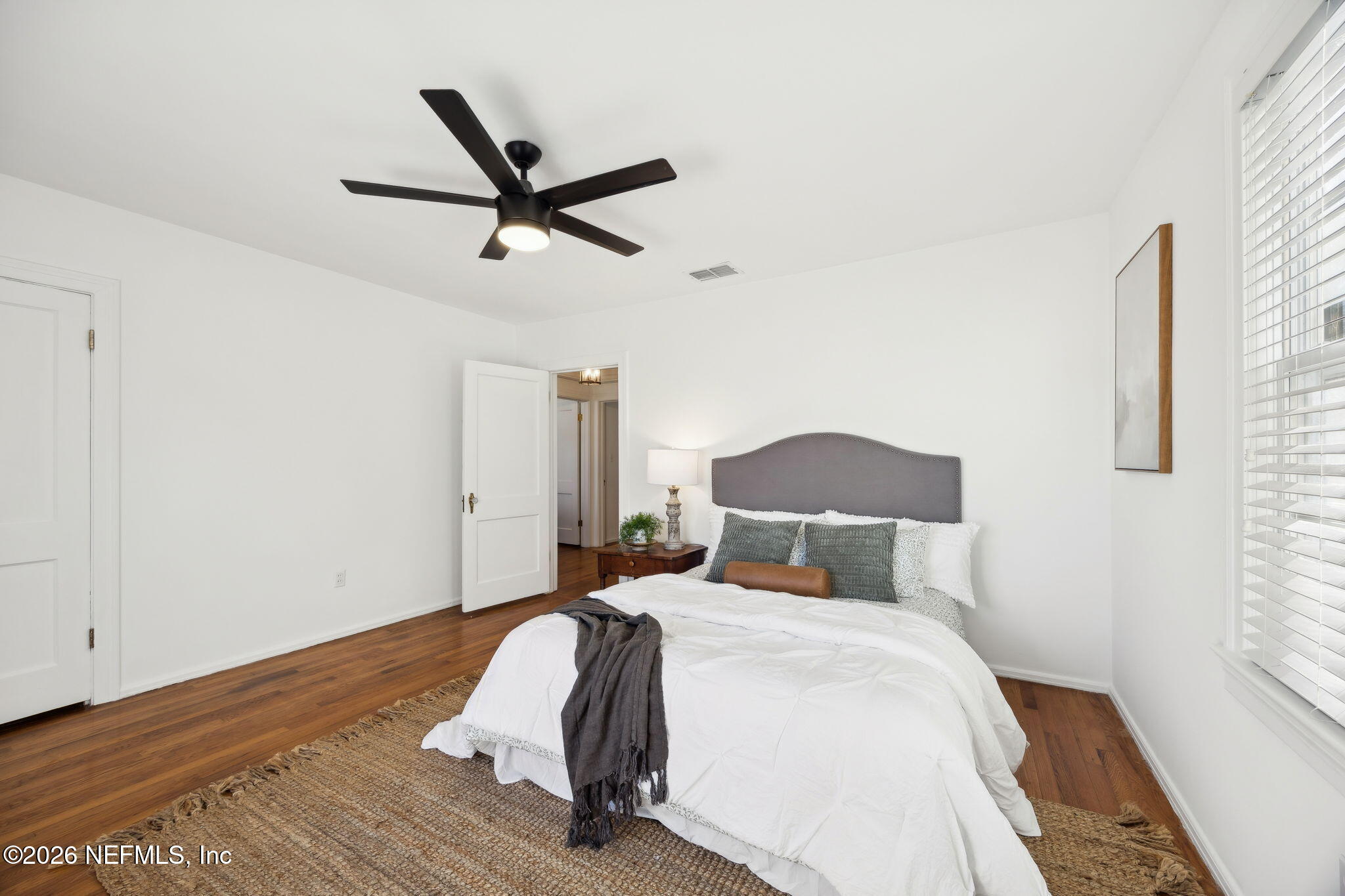 1626 Brookwood Road Jacksonville, FL 32207 - Photo 23 of 98 a bedroom with a bed and wooden floor