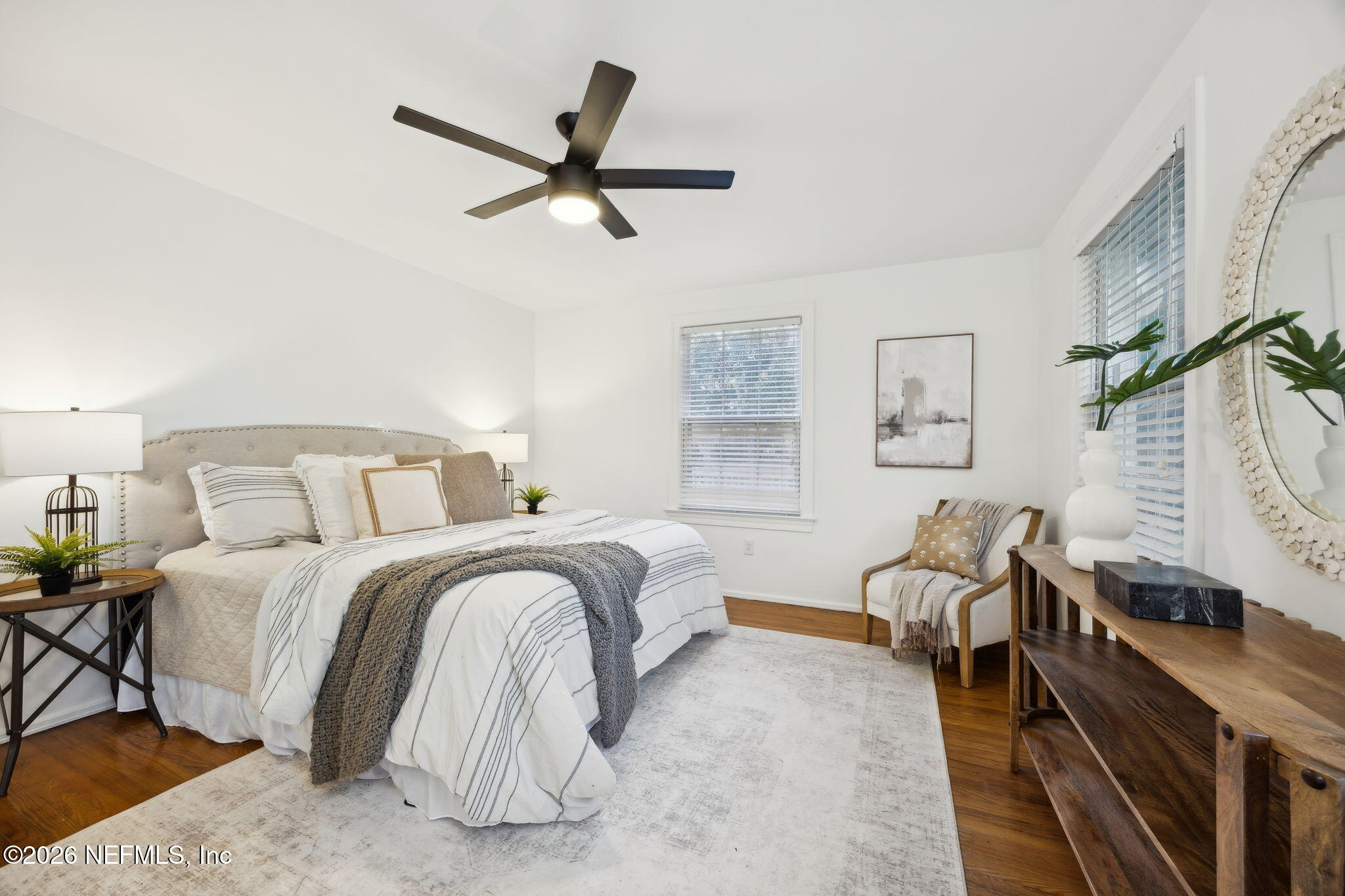 1626 Brookwood Road Jacksonville, FL 32207 - Photo 28 of 98 a spacious bedroom with a bed a couch and a window
