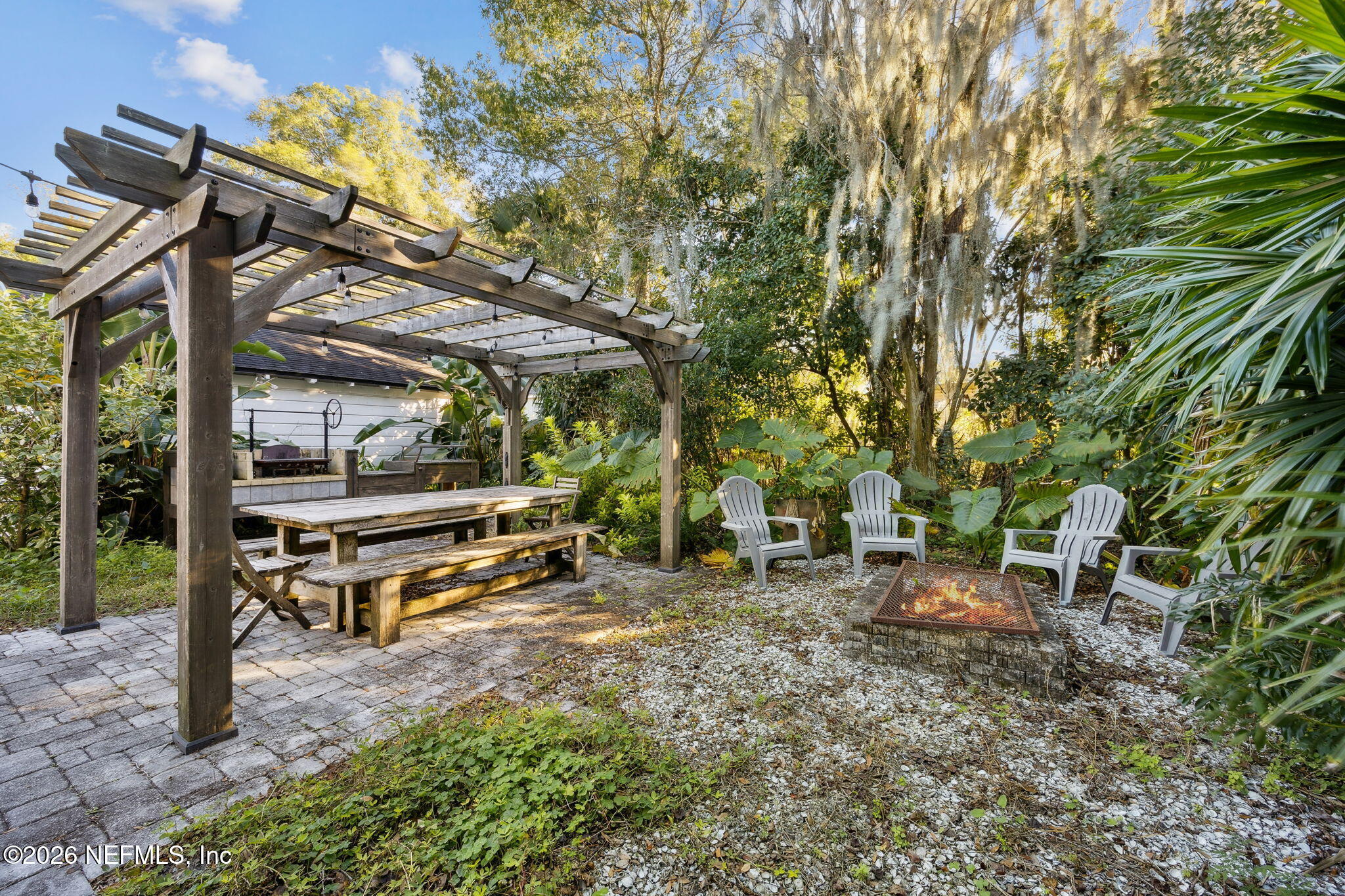 1626 Brookwood Road Jacksonville, FL 32207 - Photo 32 of 98 a view of a bench in a backyard