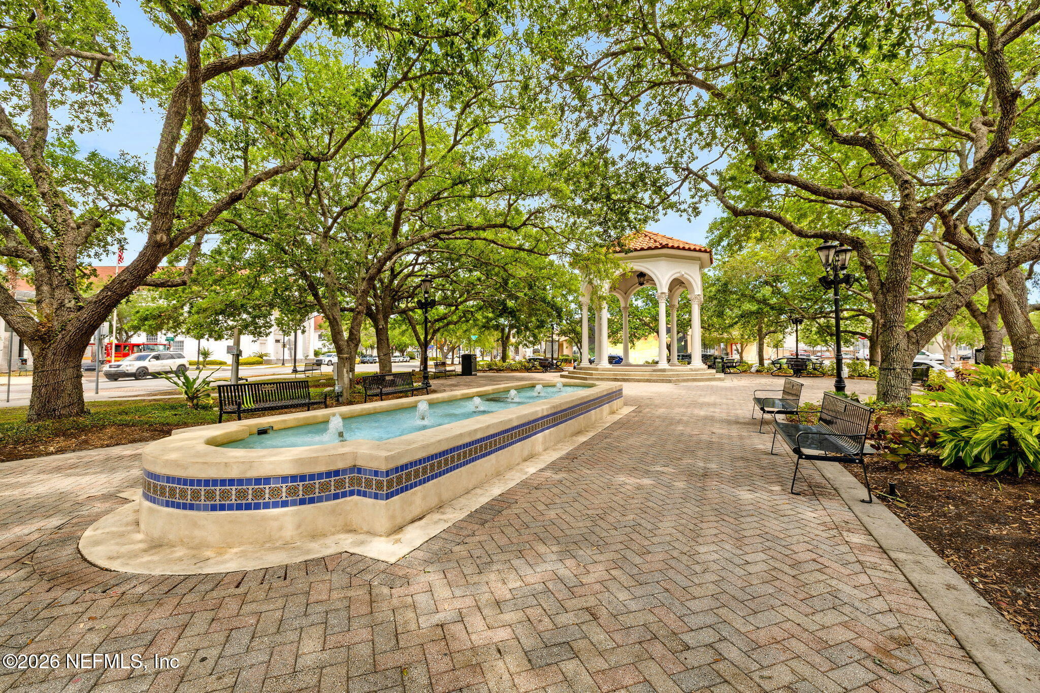 1626 Brookwood Road Jacksonville, FL 32207 - Photo 49 of 98 a view of swimming pool with outdoor seating and trees in the background