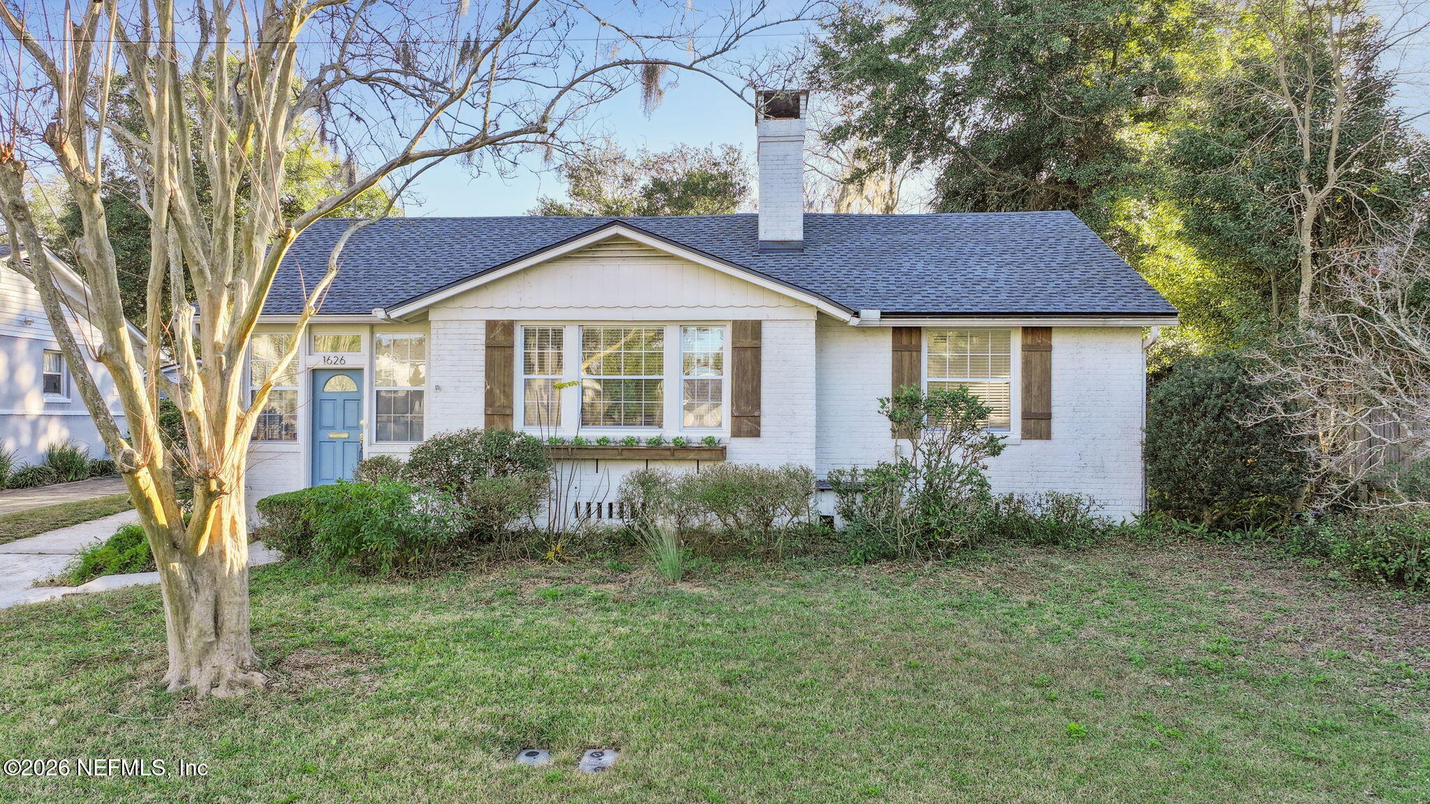 1626 Brookwood Road Jacksonville, FL 32207 - Photo 97 of 98 a front view of a house with garden
