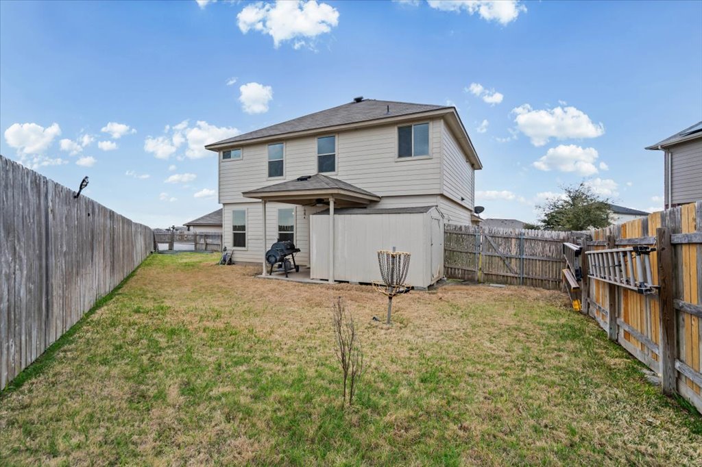 212 Plata Lane Jarrell, TX 76537 - Photo 25 of 30 Rear view of property featuring a patio and a fenced backyard