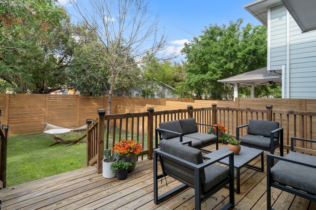 610 Bernstein Street, Unit 14 Austin, TX 78745 - Photo 37 of 39 Wooden terrace with a fenced backyard, an outdoor lounge area, and ceiling fan