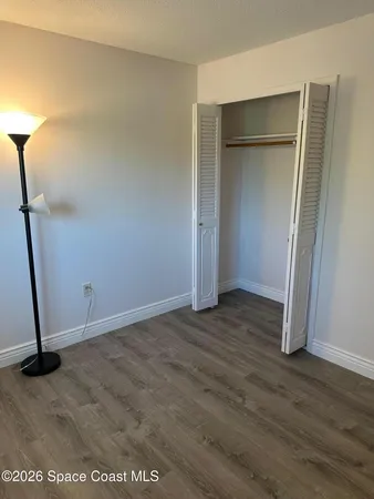 a white toilet sitting next to a bath tub