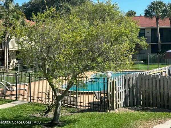 a view of a garden from a balcony