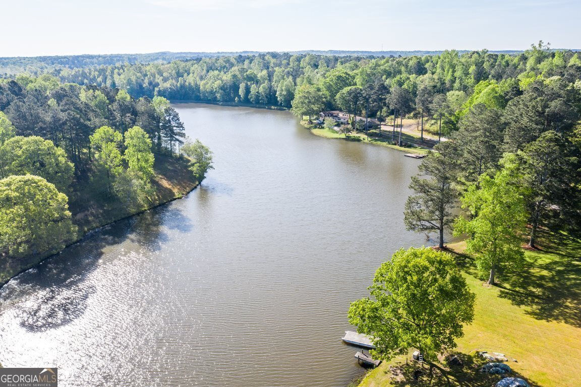 0 Four Notch Road Carrollton, GA 30116 - Photo 1 of 1 a view of a lake with a building in the background