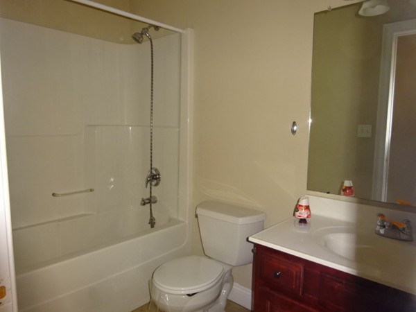 32 Pommogussett Road, Unit 8 Rutland, MA 01543 - Photo 7 of 15 a bathroom with a sink a toilet and shower