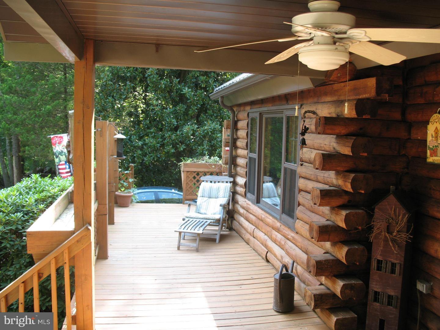 297 Jericho Road Quinton, NJ 08079 - Photo 14 of 16 a view of a chairs and tables in patio with a barbeque