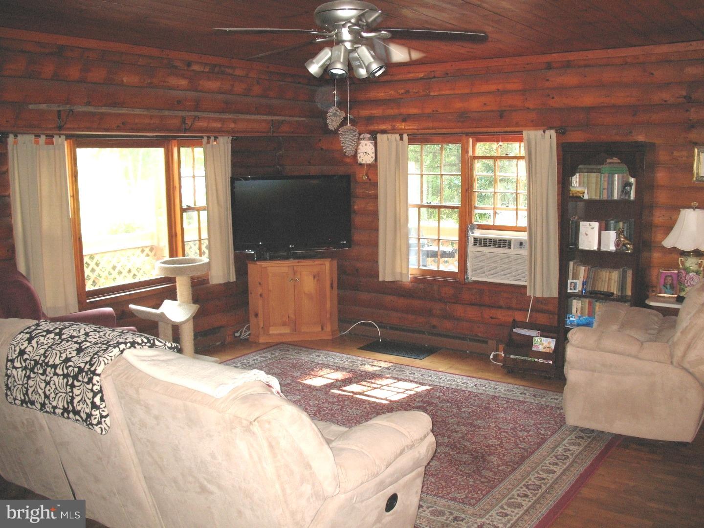 297 Jericho Road Quinton, NJ 08079 - Photo 6 of 16 a spacious bedroom with a bed and a chandelier