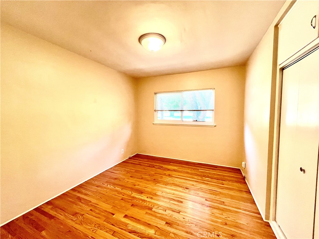 3835 Canfield Road Pasadena, CA 91107 - Photo 7 of 15 a view of a big room with wooden floor and a bathroom