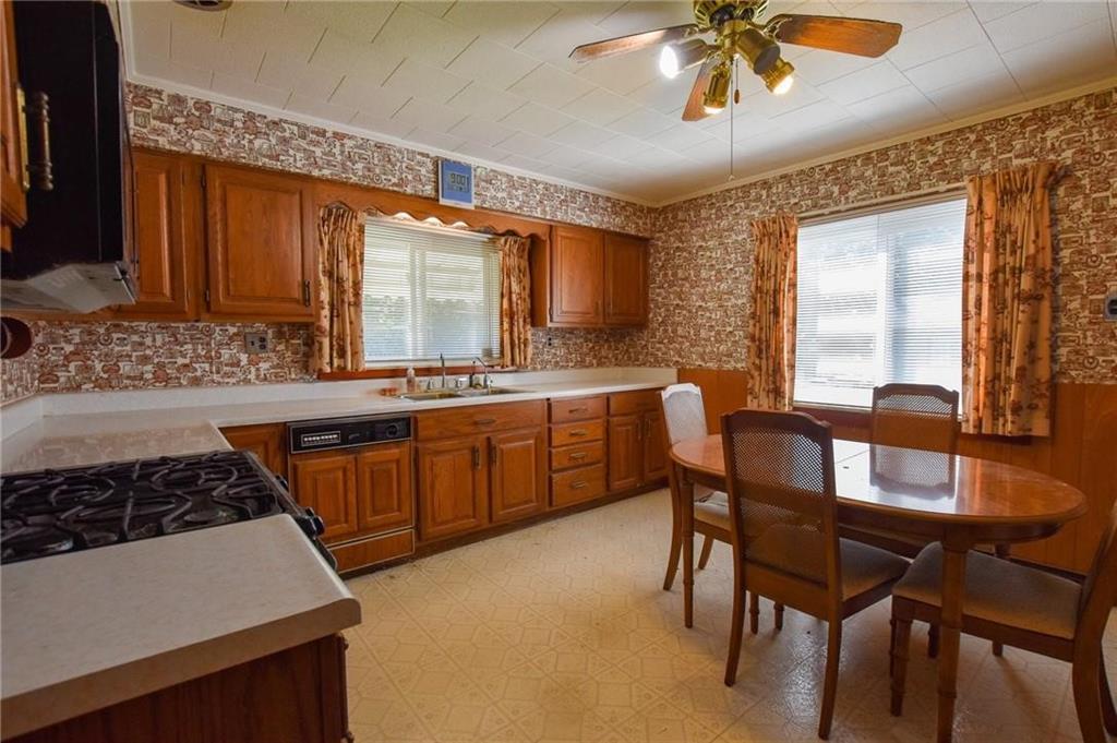694 Saxonburg Road Butler, PA 16002 - Photo 3 of 10 a kitchen with a stove a sink and a refrigerator