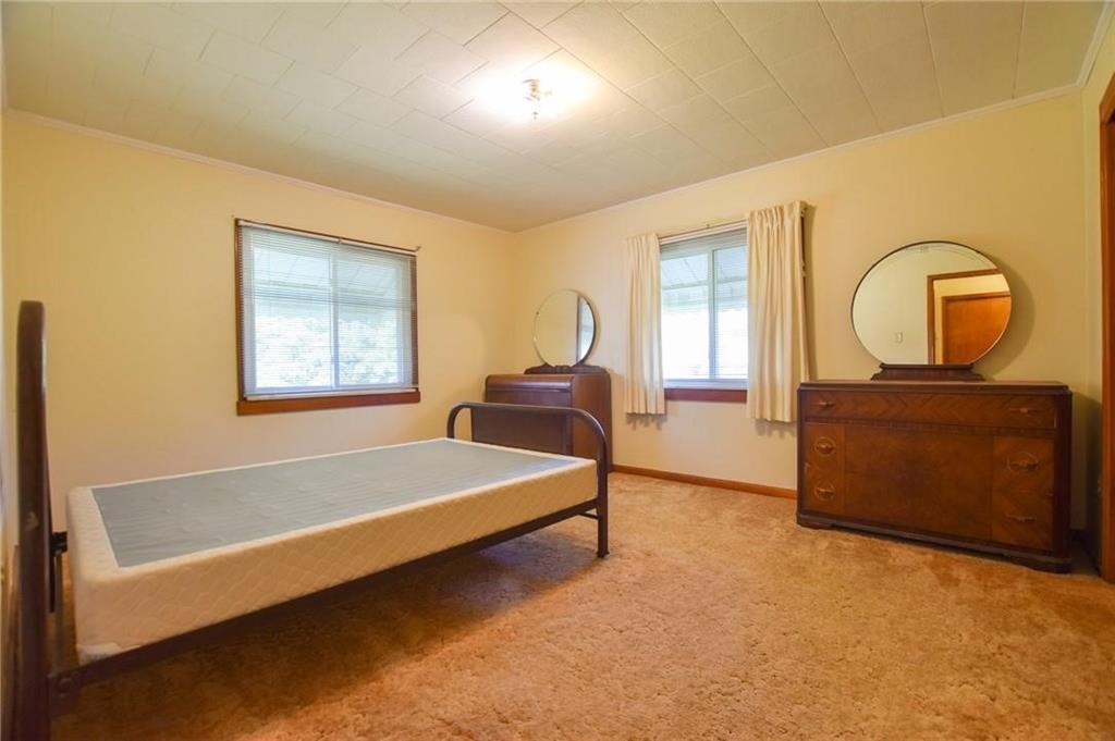 694 Saxonburg Road Butler, PA 16002 - Photo 5 of 10 a bedroom with a bed large window and mirror