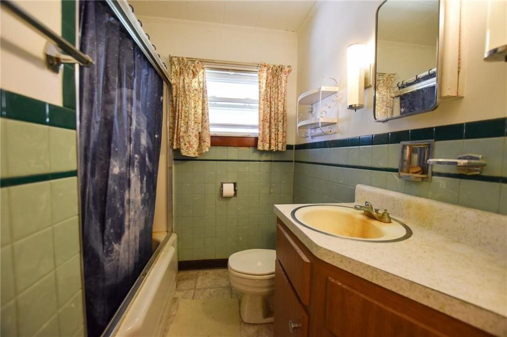 694 Saxonburg Road Butler, PA 16002 - Photo 7 of 10 a bathroom with a sink a toilet and mirror