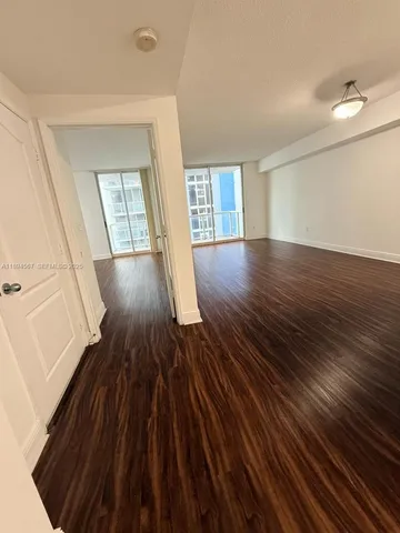 wooden floor in a hall with an entryway