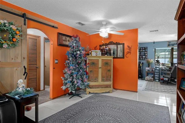 a view of a living room and entryway