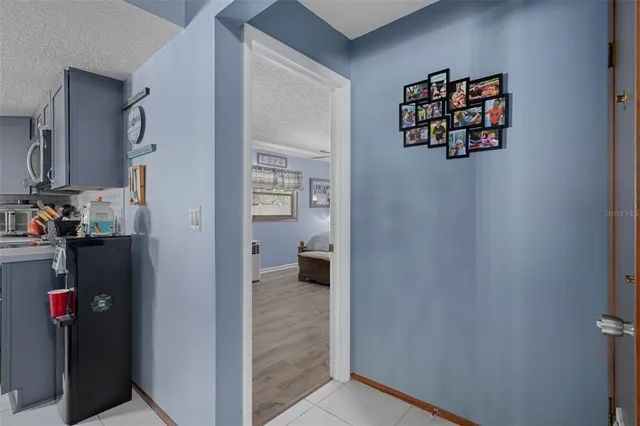 a view of living room with furniture and wooden floor