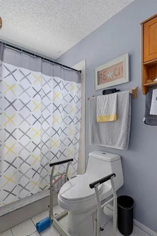 a view of a kitchen center island and living room