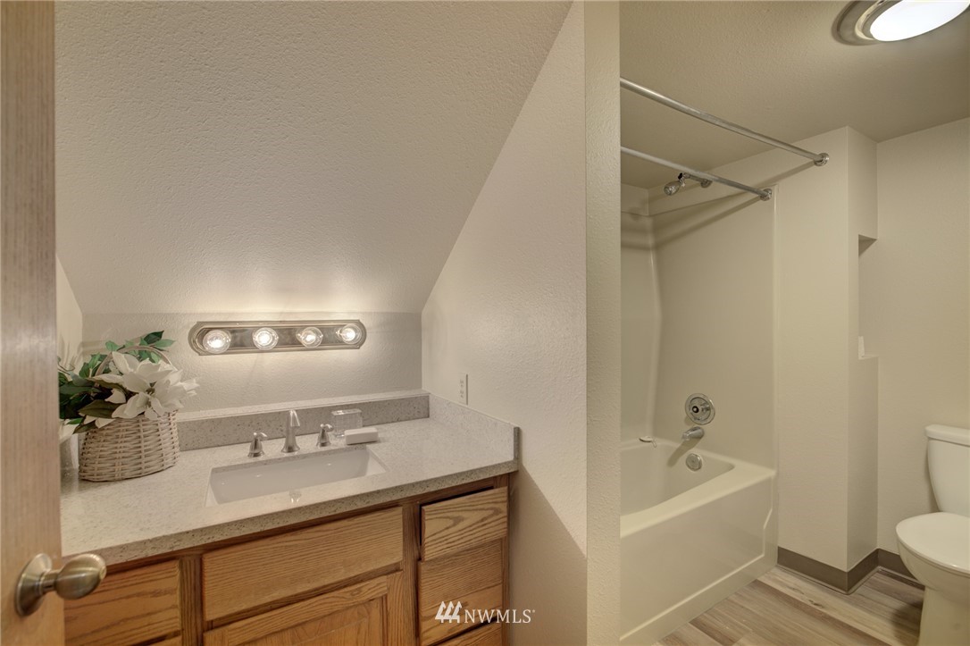 121 Logan Avenue South Renton, WA 98057 - Photo 14 of 25 a bathroom with a sink a toilet and shower