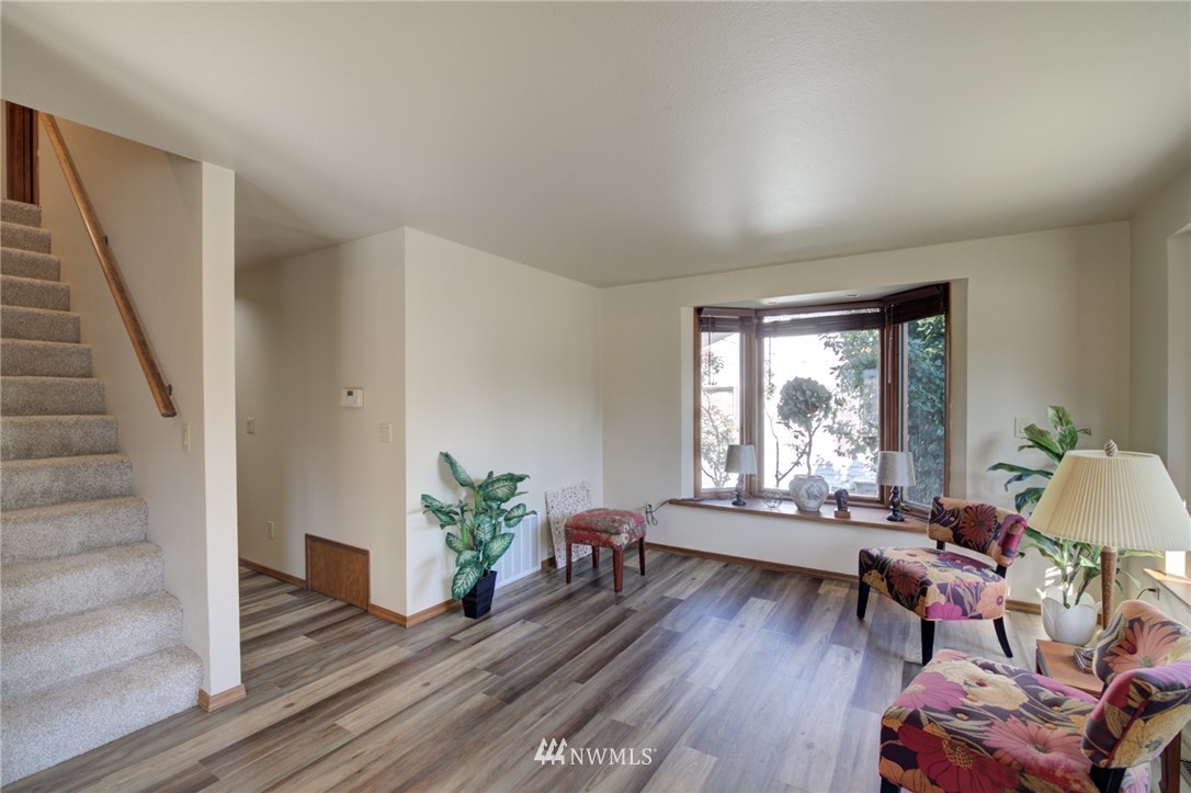 121 Logan Avenue South Renton, WA 98057 - Photo 5 of 25 a living room with furniture and a wooden floor