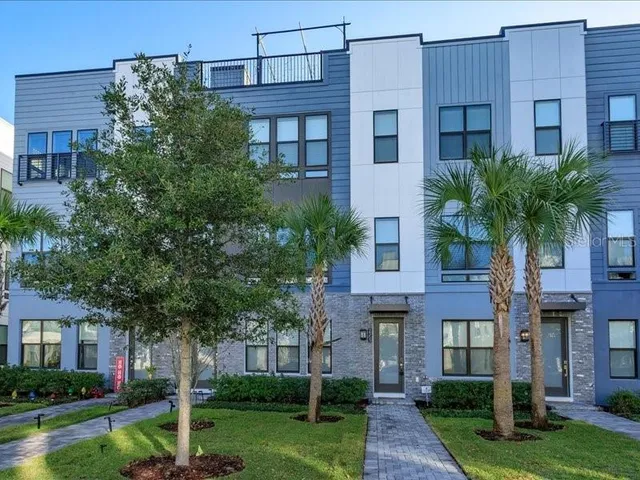 a front view of a building with garden