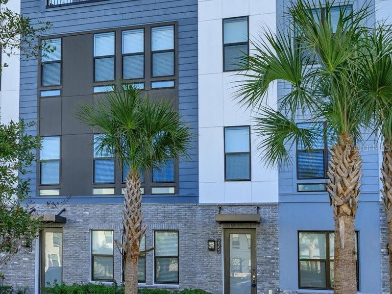 2353 Brix Street Orlando, FL 32804 - Photo 2 of 25 a front view of a multi story building with yard