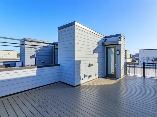 a view of a living room with wooden floor