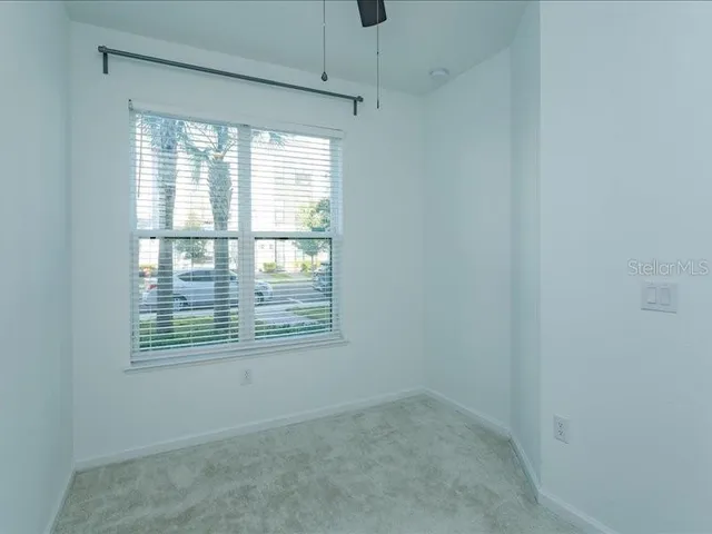 a view of an empty room with a window