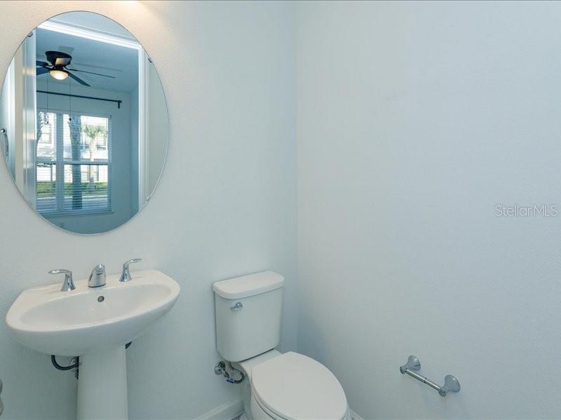 2353 Brix Street Orlando, FL 32804 - Photo 5 of 25 a bathroom with a sink mirror and toilet