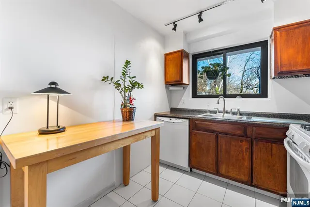 a kitchen with a sink and a large window