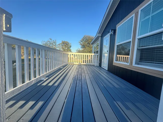 a view of deck with wooden floor and fence