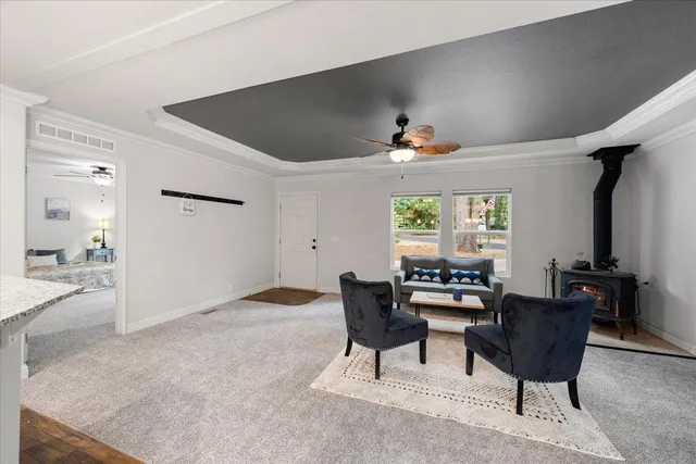 a dining room with furniture and window