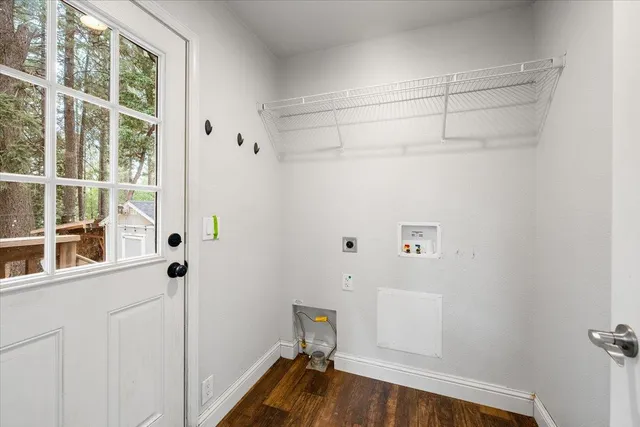 a view of a room with wooden floor and windows