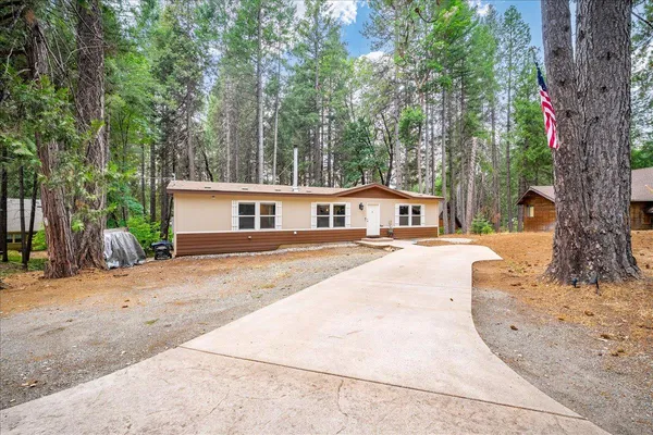front view of a house with a yard