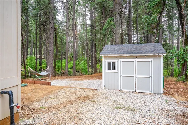 a view of a house with a yard and garage