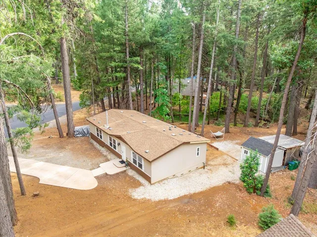 a view of a backyard with a patio