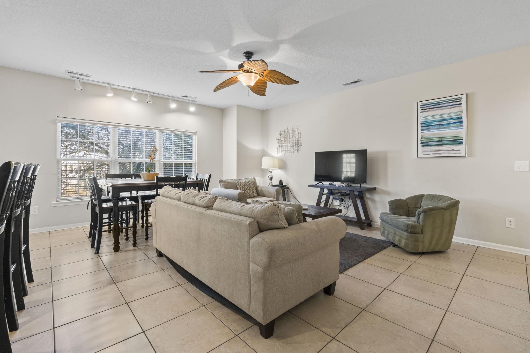 311 B 3rd Avenue North Surfside Beach, SC 29575 - Photo 16 of 39 Living room featuring light tile patterned flooring, a ceiling fan, and track lighting