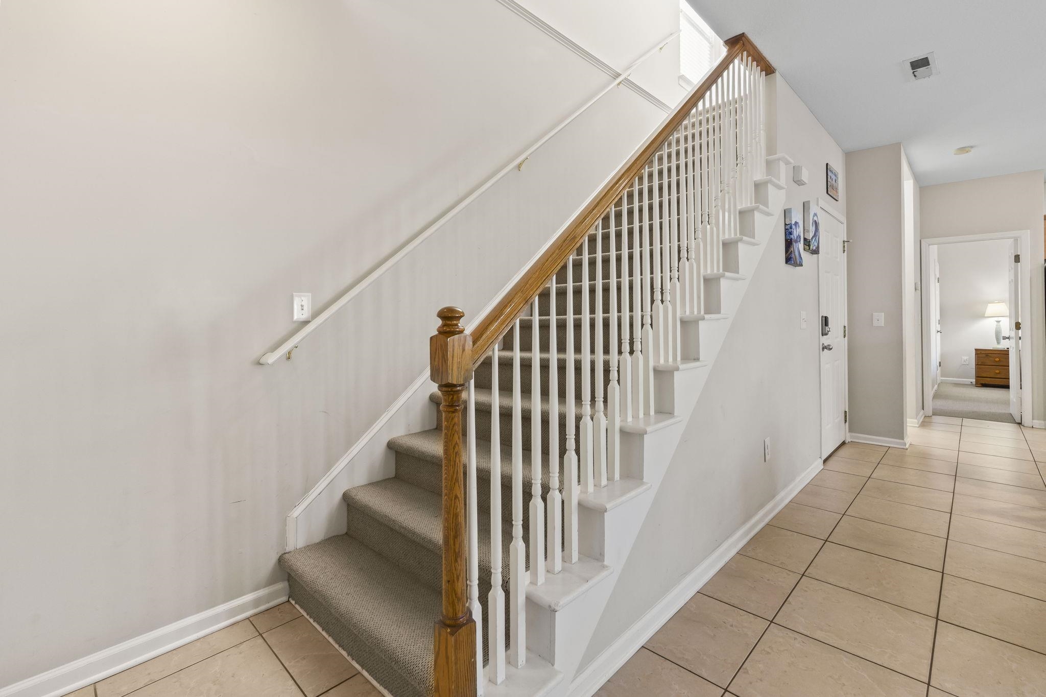 311 B 3rd Avenue North Surfside Beach, SC 29575 - Photo 18 of 39 Stairway with tile patterned flooring and baseboards
