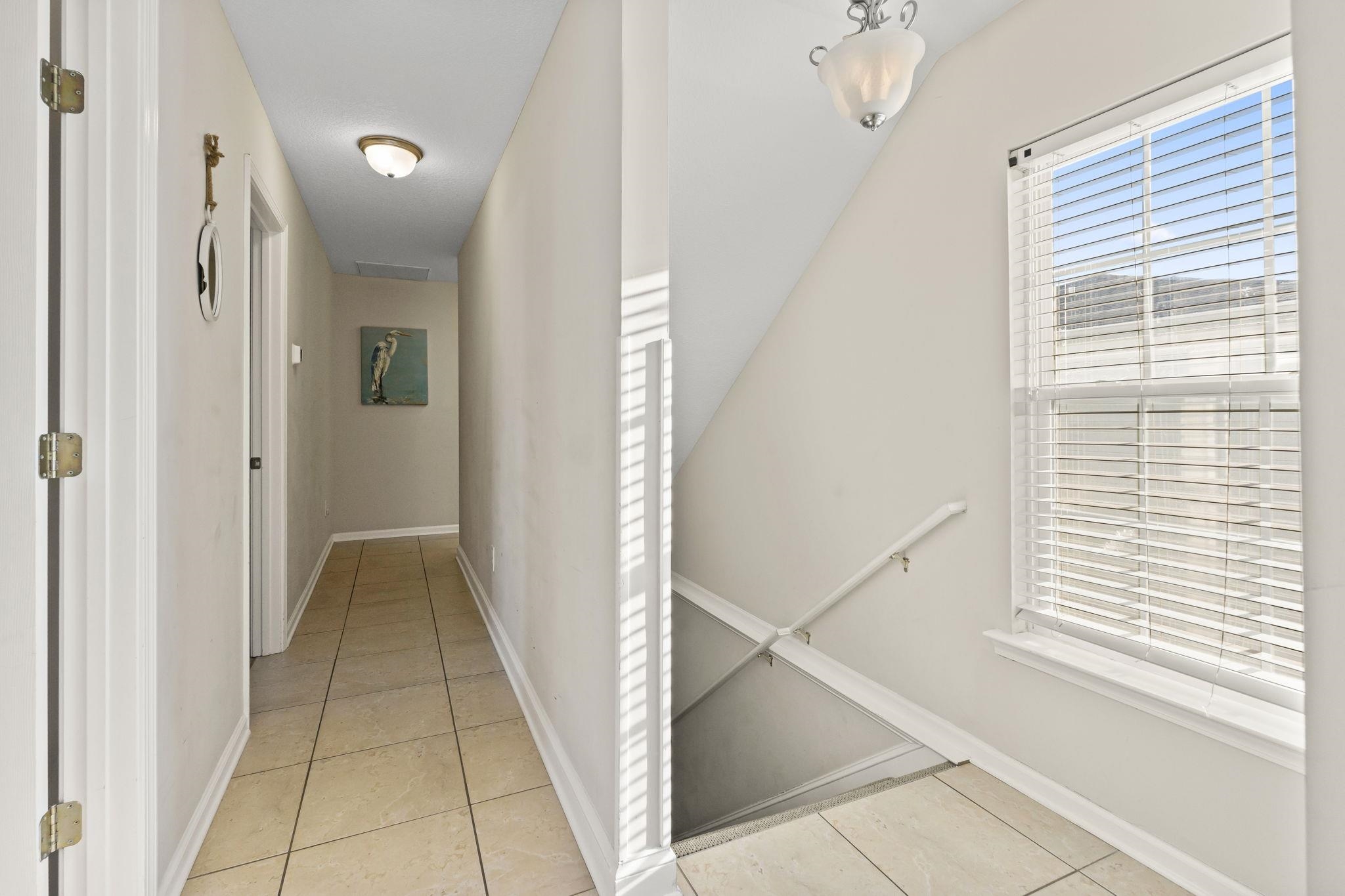 311 B 3rd Avenue North Surfside Beach, SC 29575 - Photo 19 of 39 Hallway featuring light tile patterned floors