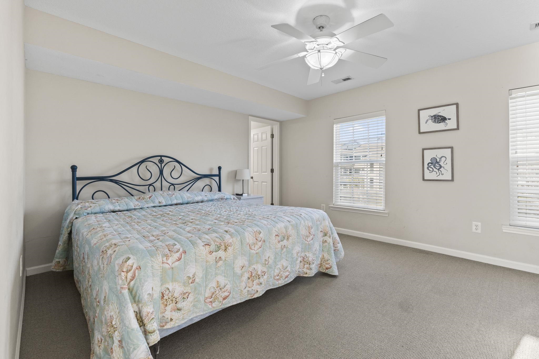 311 B 3rd Avenue North Surfside Beach, SC 29575 - Photo 20 of 39 Bedroom with carpet floors and a ceiling fan