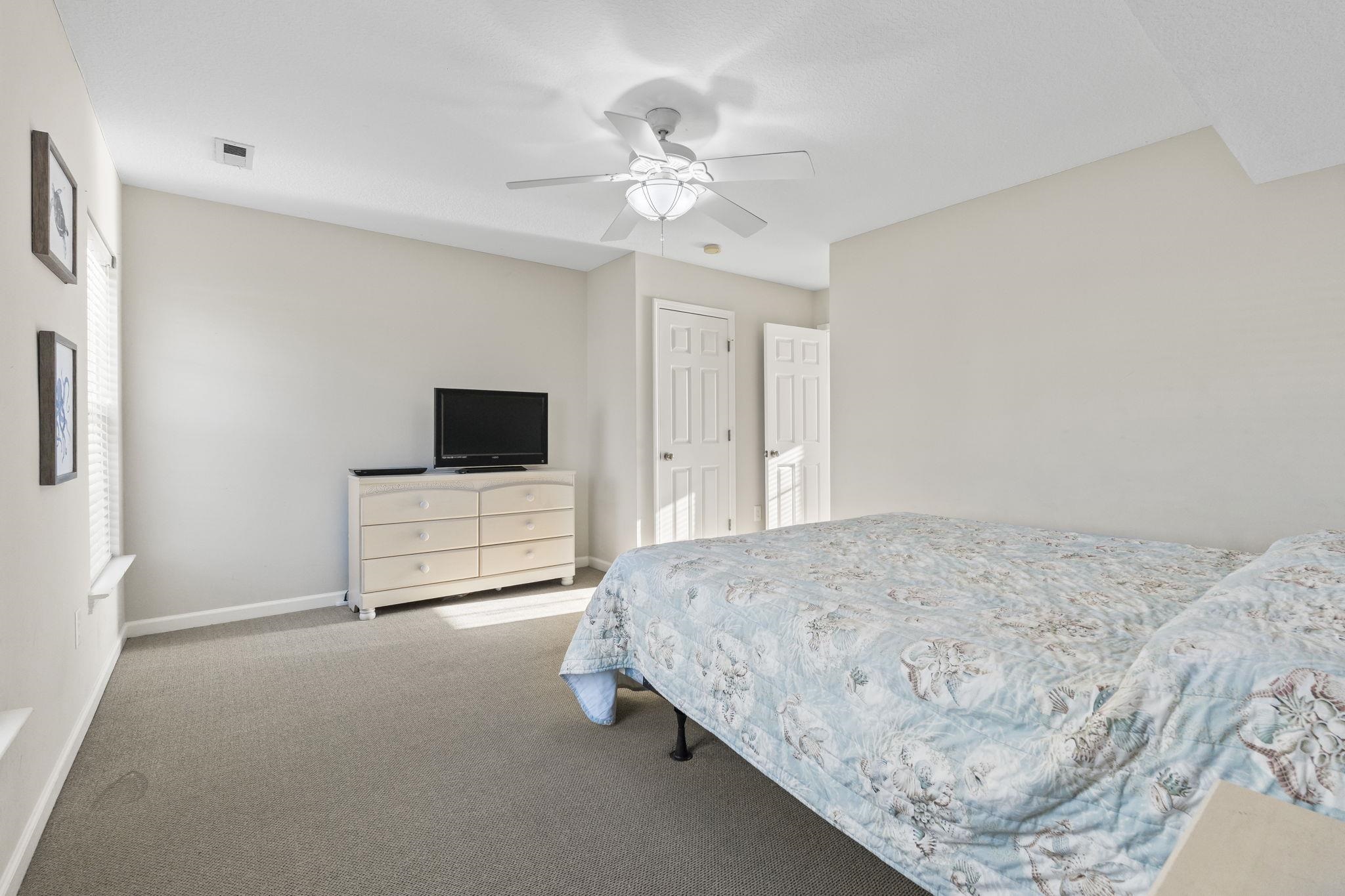311 B 3rd Avenue North Surfside Beach, SC 29575 - Photo 25 of 39 Bedroom with carpet floors and a ceiling fan