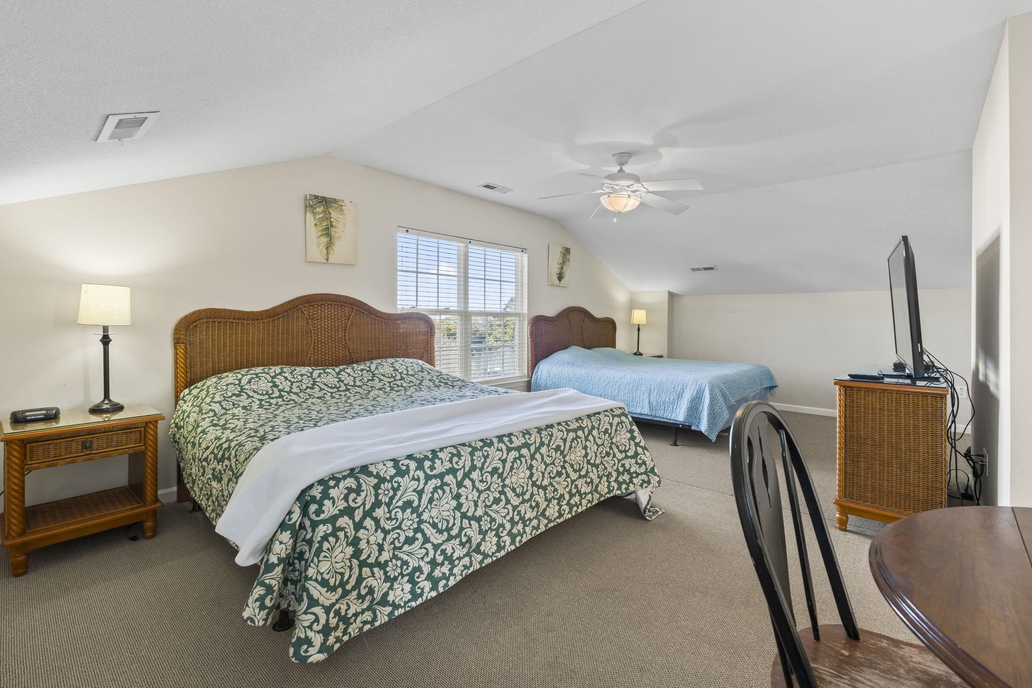 311 B 3rd Avenue North Surfside Beach, SC 29575 - Photo 27 of 39 Carpeted bedroom with vaulted ceiling and a ceiling fan
