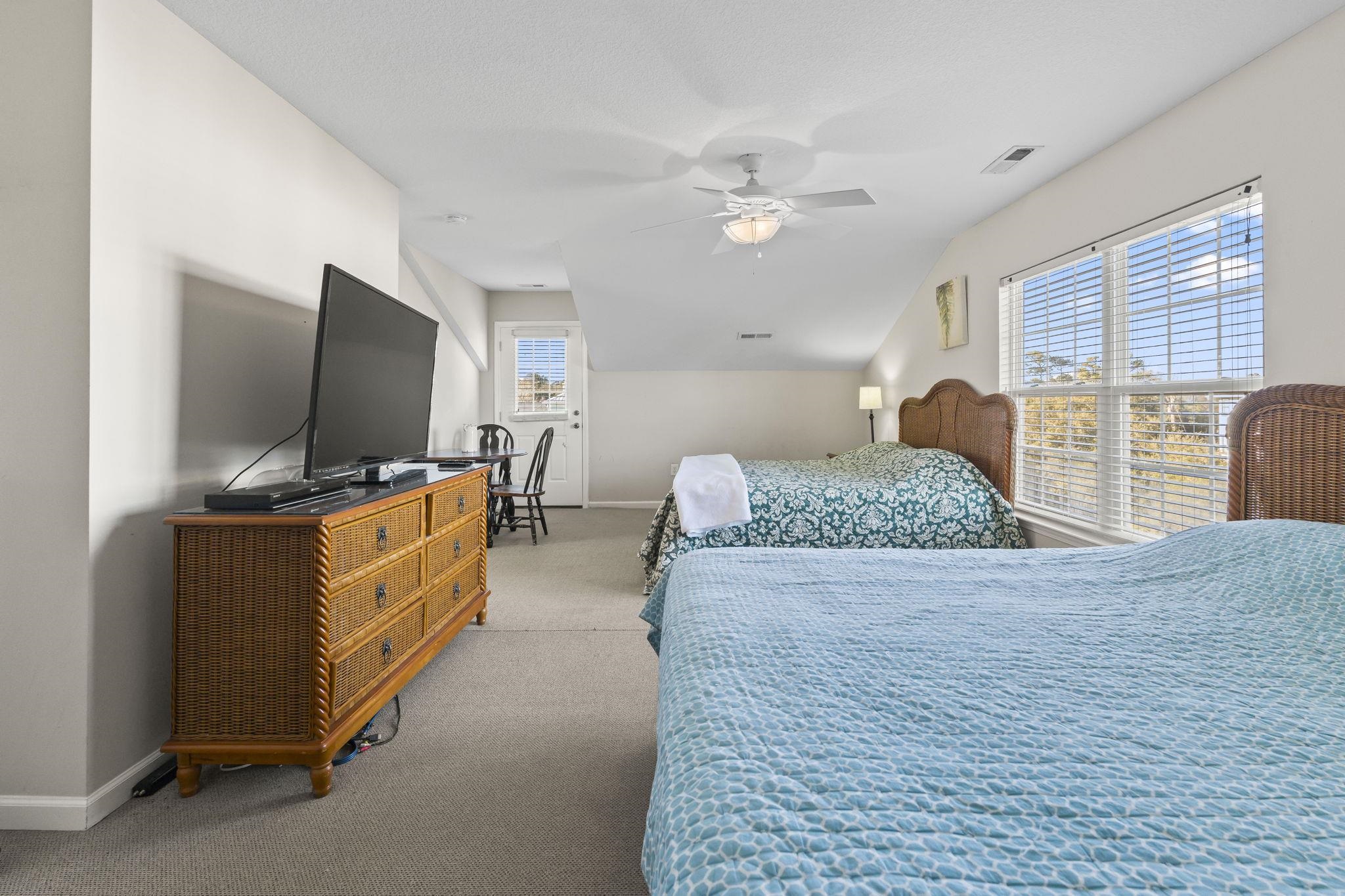 311 B 3rd Avenue North Surfside Beach, SC 29575 - Photo 28 of 39 Bedroom with lofted ceiling, ceiling fan, and carpet flooring