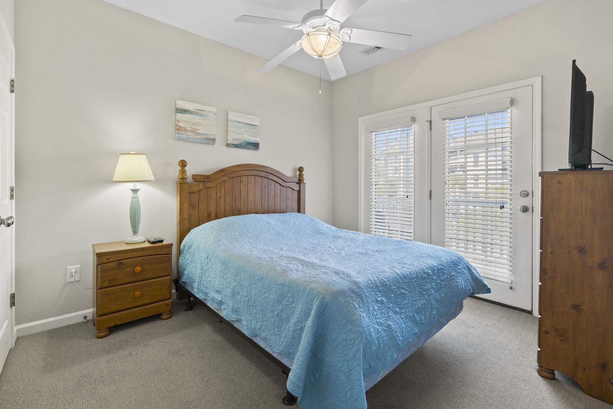 311 B 3rd Avenue North Surfside Beach, SC 29575 - Photo 9 of 39 Carpeted bedroom with access to exterior and a ceiling fan