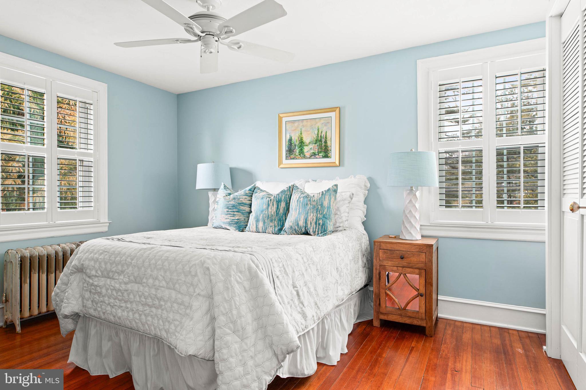 444 St Davids Avenue Wayne, PA 19087 - Photo 12 of 28 a bedroom with a bed and wooden floor