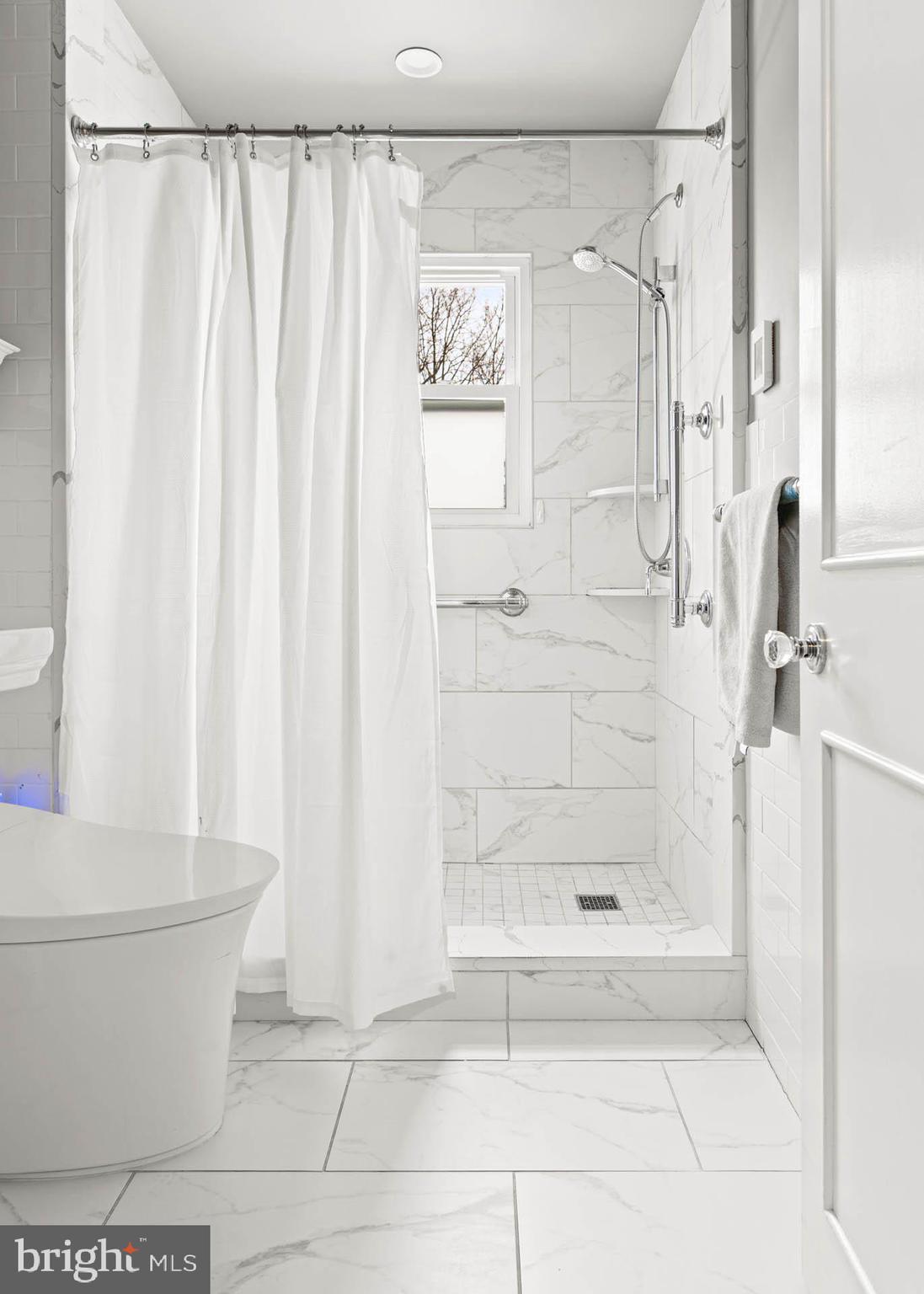 444 St Davids Avenue Wayne, PA 19087 - Photo 16 of 28 a bathroom with a shower and a toilet