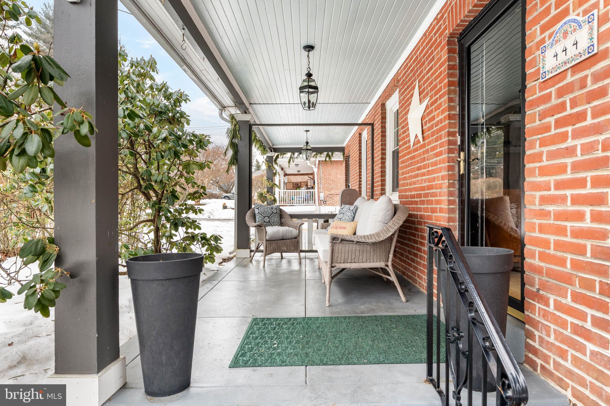444 St Davids Avenue Wayne, PA 19087 - Photo 2 of 28 a view of a patio with table and chairs potted plants with wooden floor