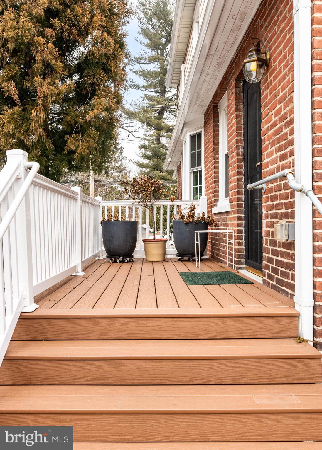 444 St Davids Avenue Wayne, PA 19087 - Photo 25 of 28 a view of a patio with couches chairs and wooden floor