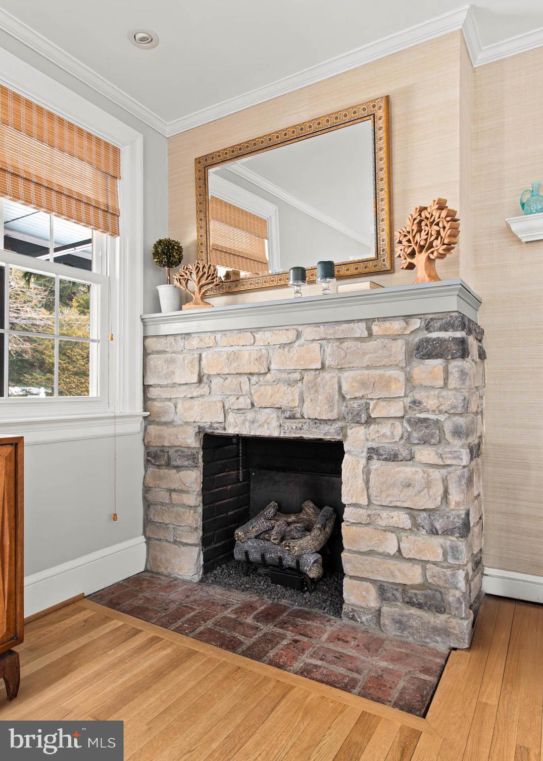 444 St Davids Avenue Wayne, PA 19087 - Photo 4 of 28 a living room with a fireplace and a floor