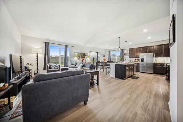 a spacious bedroom with a bed and glass door