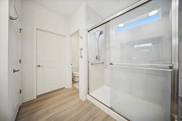 a spacious bathroom with a granite countertop sink mirror and double